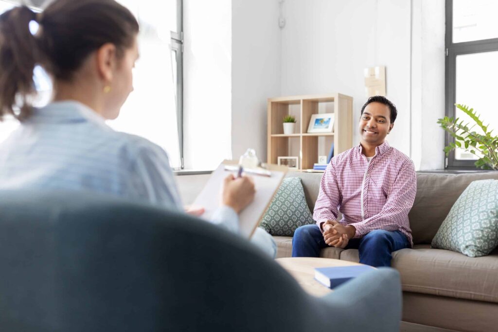 man following up in therapy between behavioral health TMS sessions